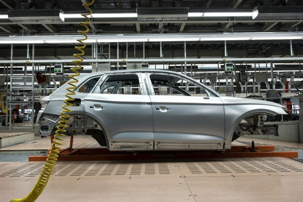 Vehicle body on an assembly line inside an automotive factory